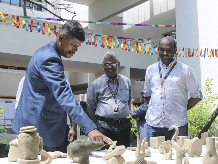 Prospective students exploring design projects and creative exhibits during the Open House at CARE School of Design