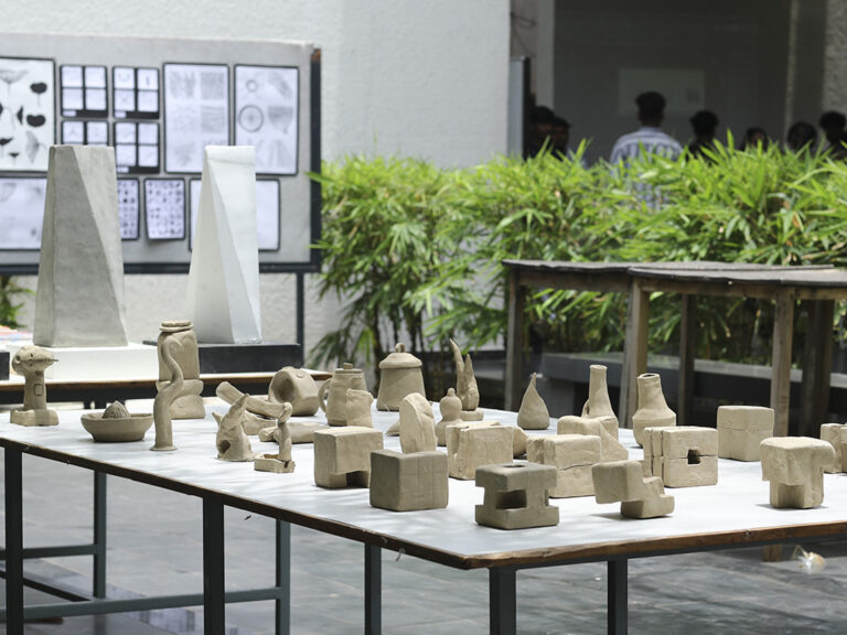 Prospective students exploring design projects and creative exhibits during the Open House at CARE School of Design