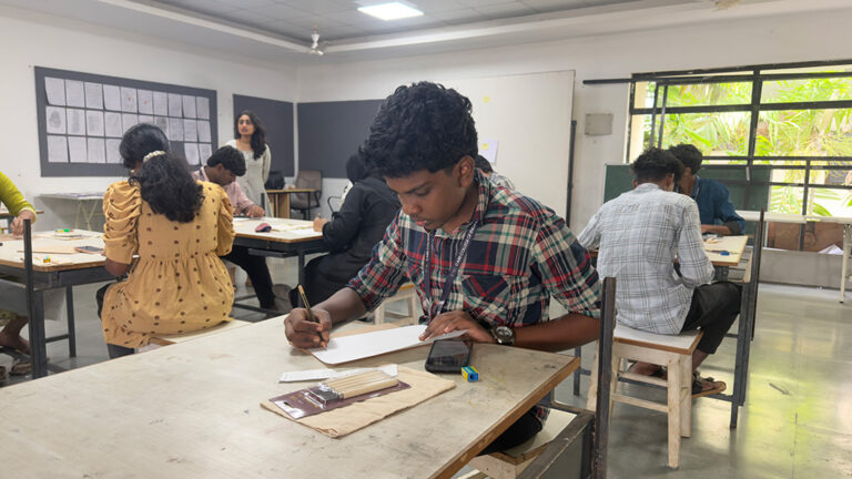 Design students creating linocut print artwork during hands-on printmaking workshop at CARE School of Design