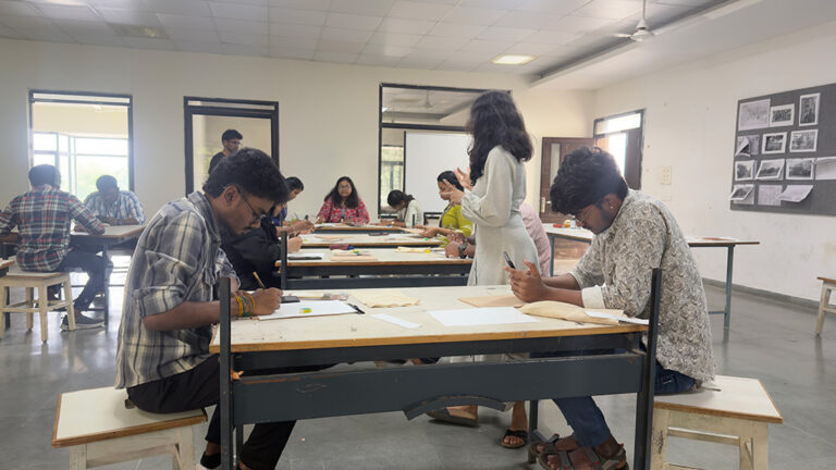 Design students creating linocut print artwork during hands-on printmaking workshop at CARE School of Design