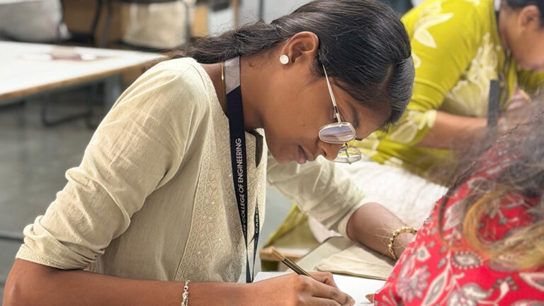 Design students creating linocut print artwork during hands-on printmaking workshop at CARE School of Design