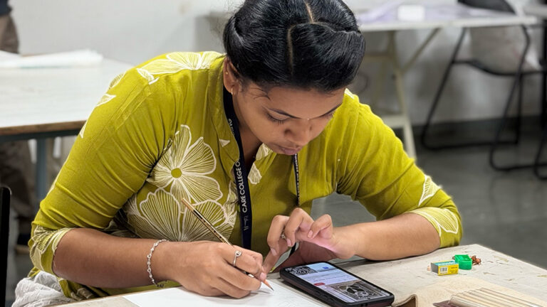 Design students creating linocut print artwork during hands-on printmaking workshop at CARE School of Design
