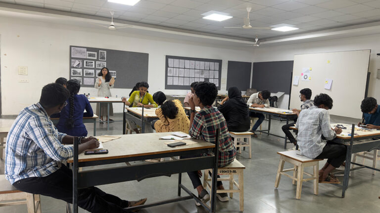 Design students creating linocut print artwork during hands-on printmaking workshop at CARE School of Design