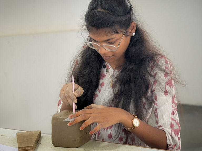 Bachelor of Design students learning clay modelling techniques during a hands-on workshop at CARE School of Design