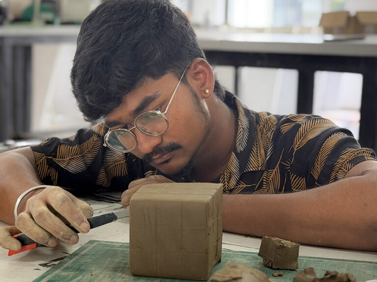 Bachelor of Design students learning clay modelling techniques during a hands-on workshop at CARE School of Design