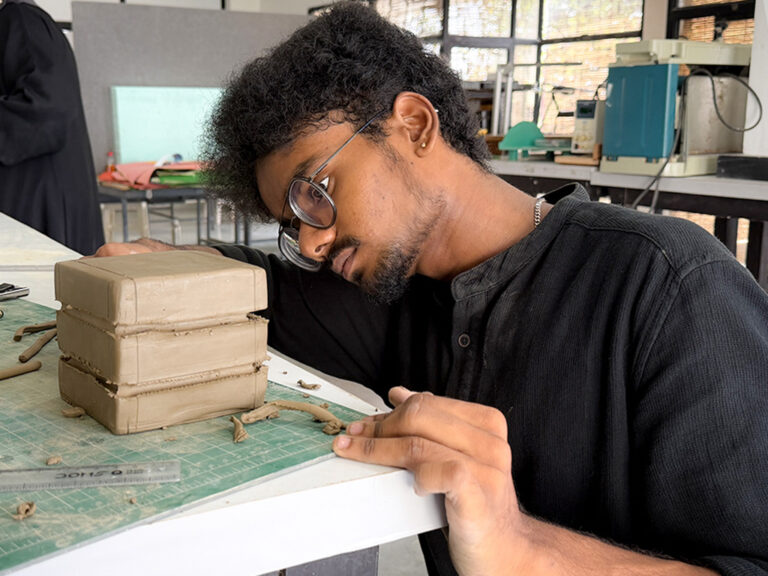 Bachelor of Design students learning clay modelling techniques during a hands-on workshop at CARE School of Design