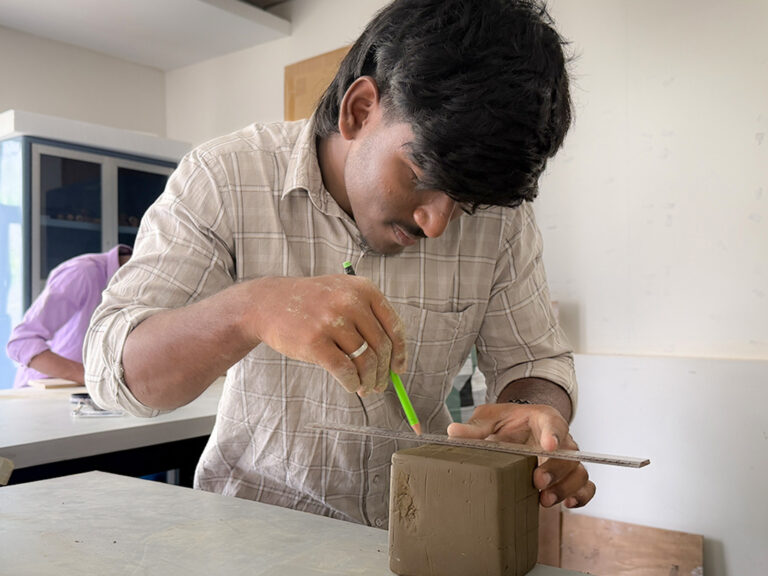 Bachelor of Design students learning clay modelling techniques during a hands-on workshop at CARE School of Design